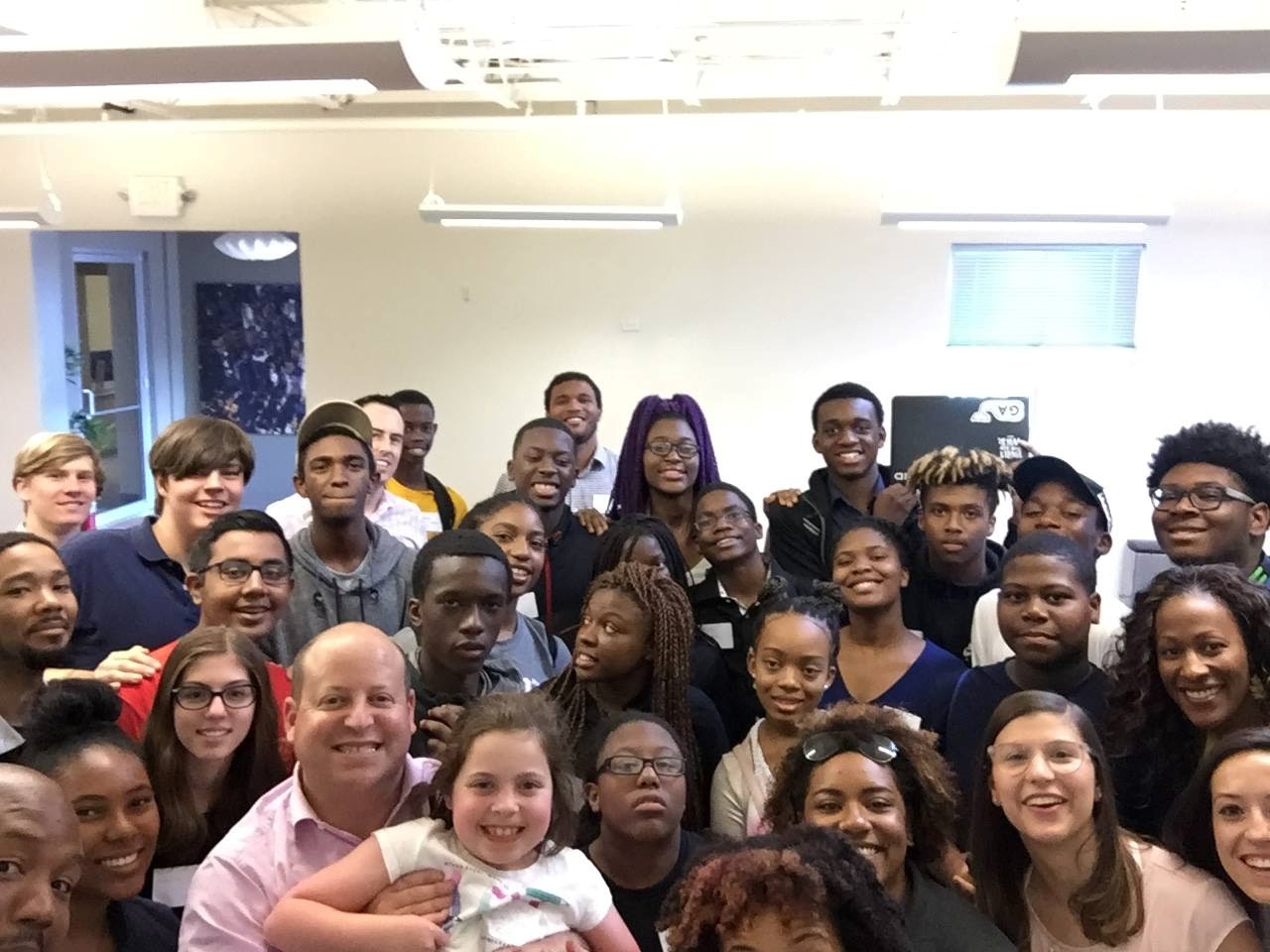 AI Center of Excellence participants gathered together during a collaborative session